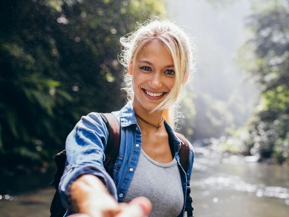 Young woman by a river