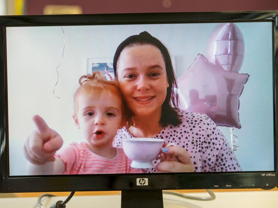 woman and child holding cup