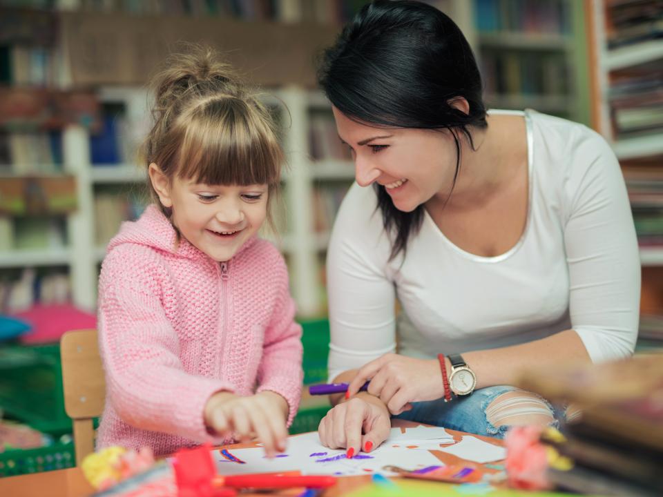 Primary school child and teacher