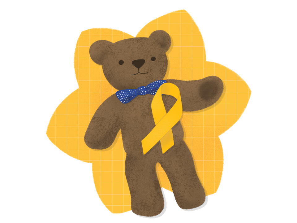 A teddy wearing the gold ribbon that symbolises children's cancer