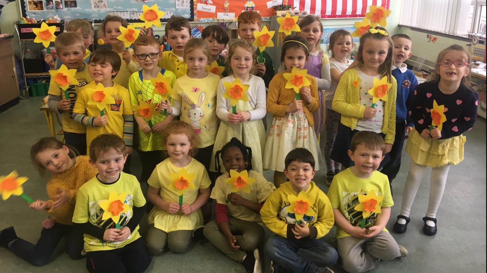 Elementary school students with daffodils