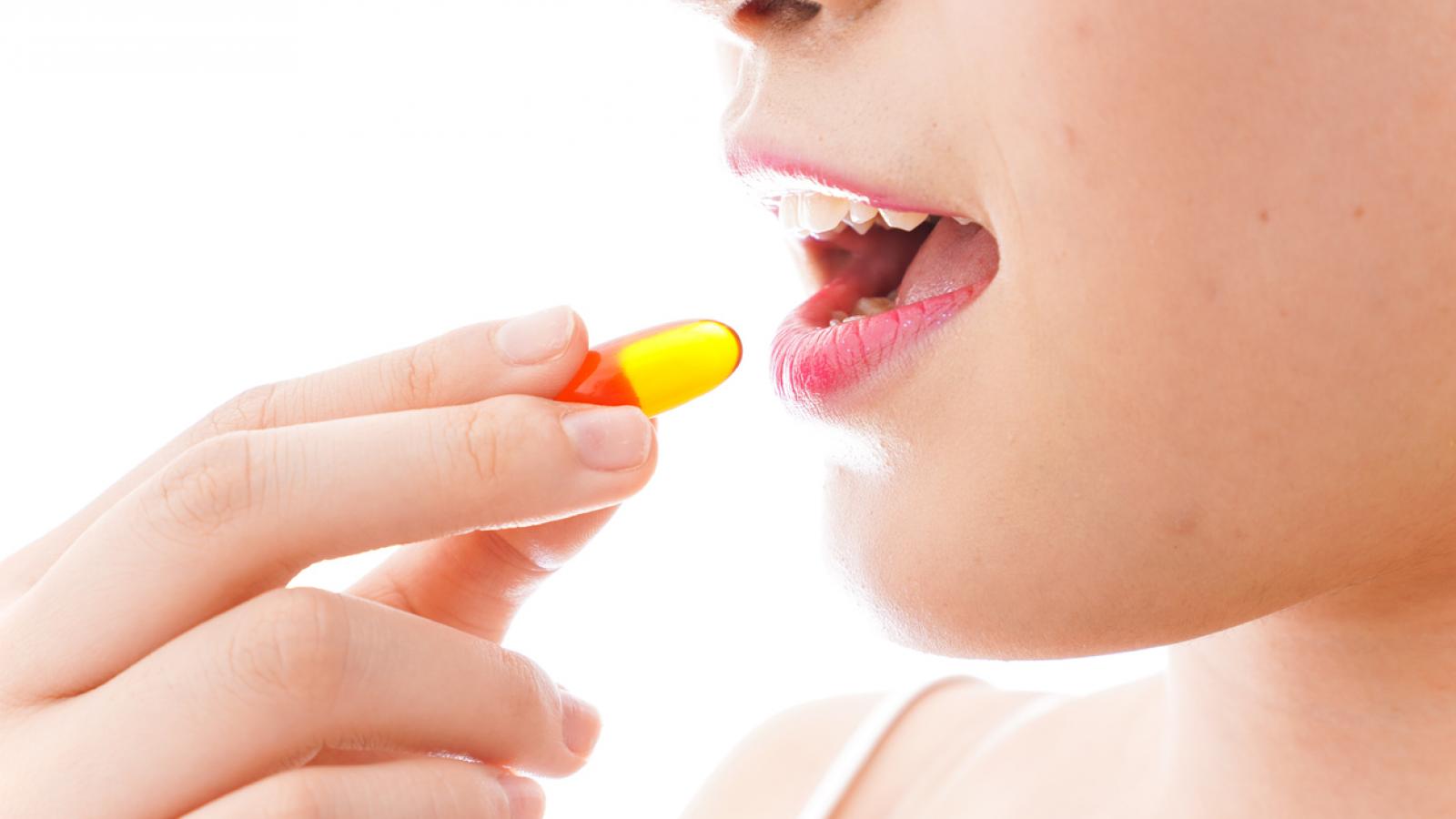 Woman taking a pill