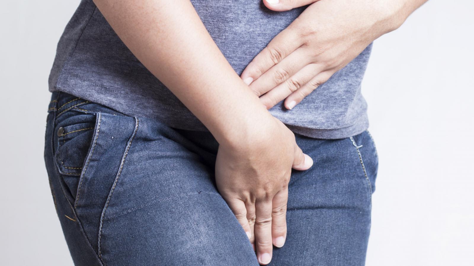 Woman holding her pelvic area