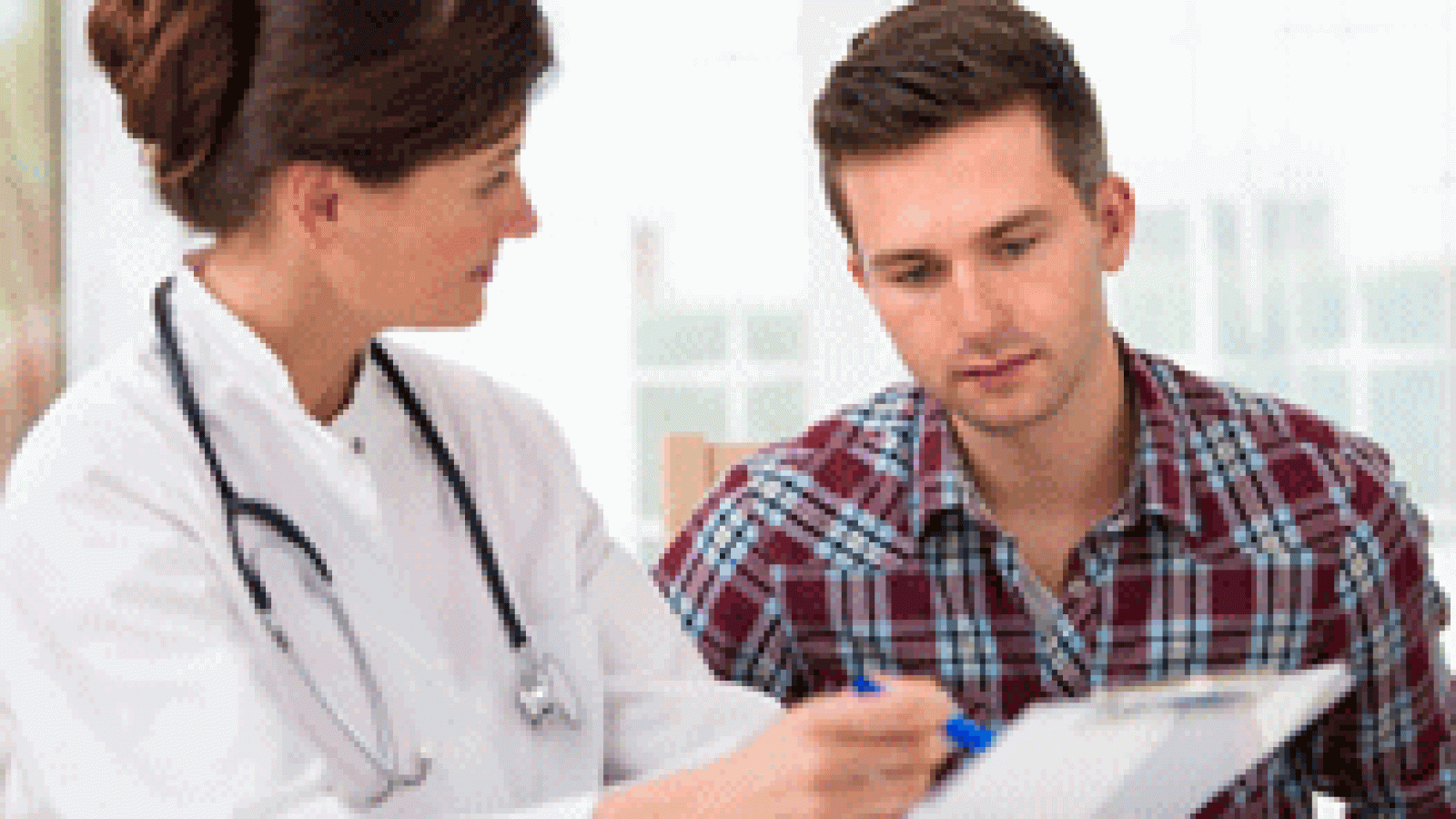 Doctor explaining something to a male patient
