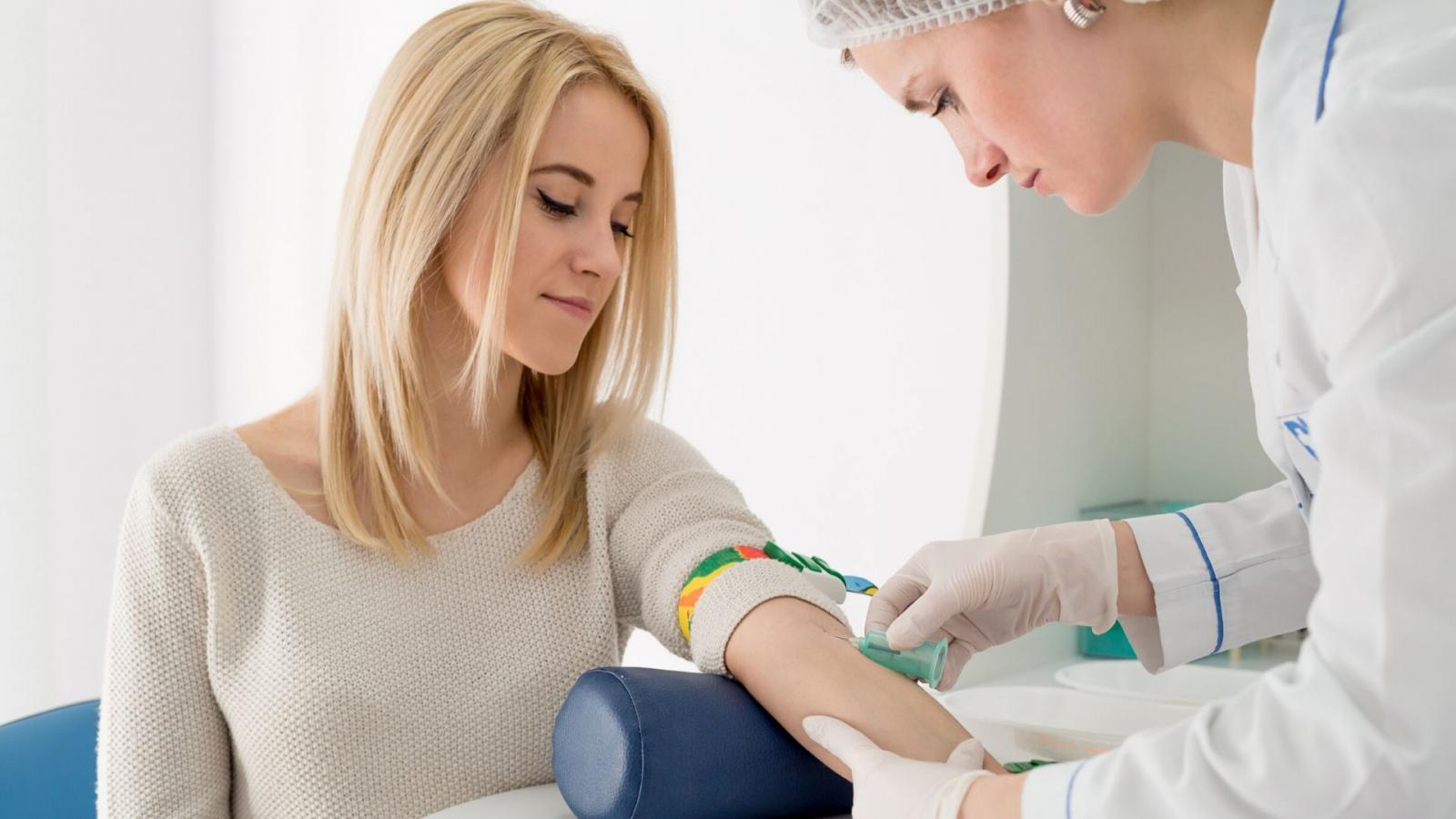 Teenager undergoing blood test