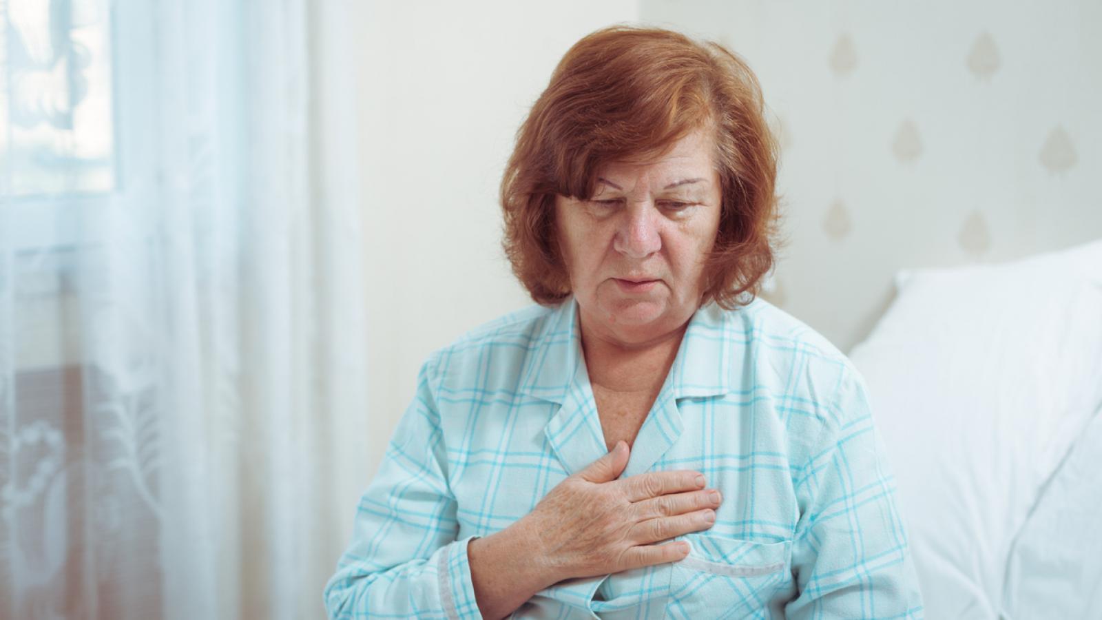 Older woman concerned at pain in her chest