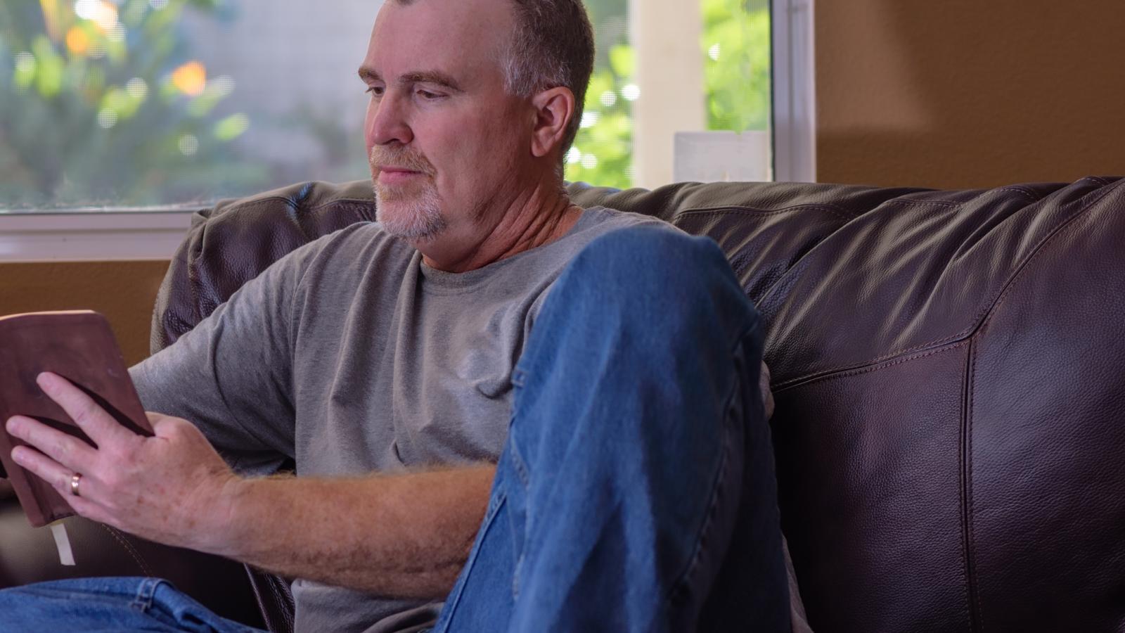 Middle aged man reading