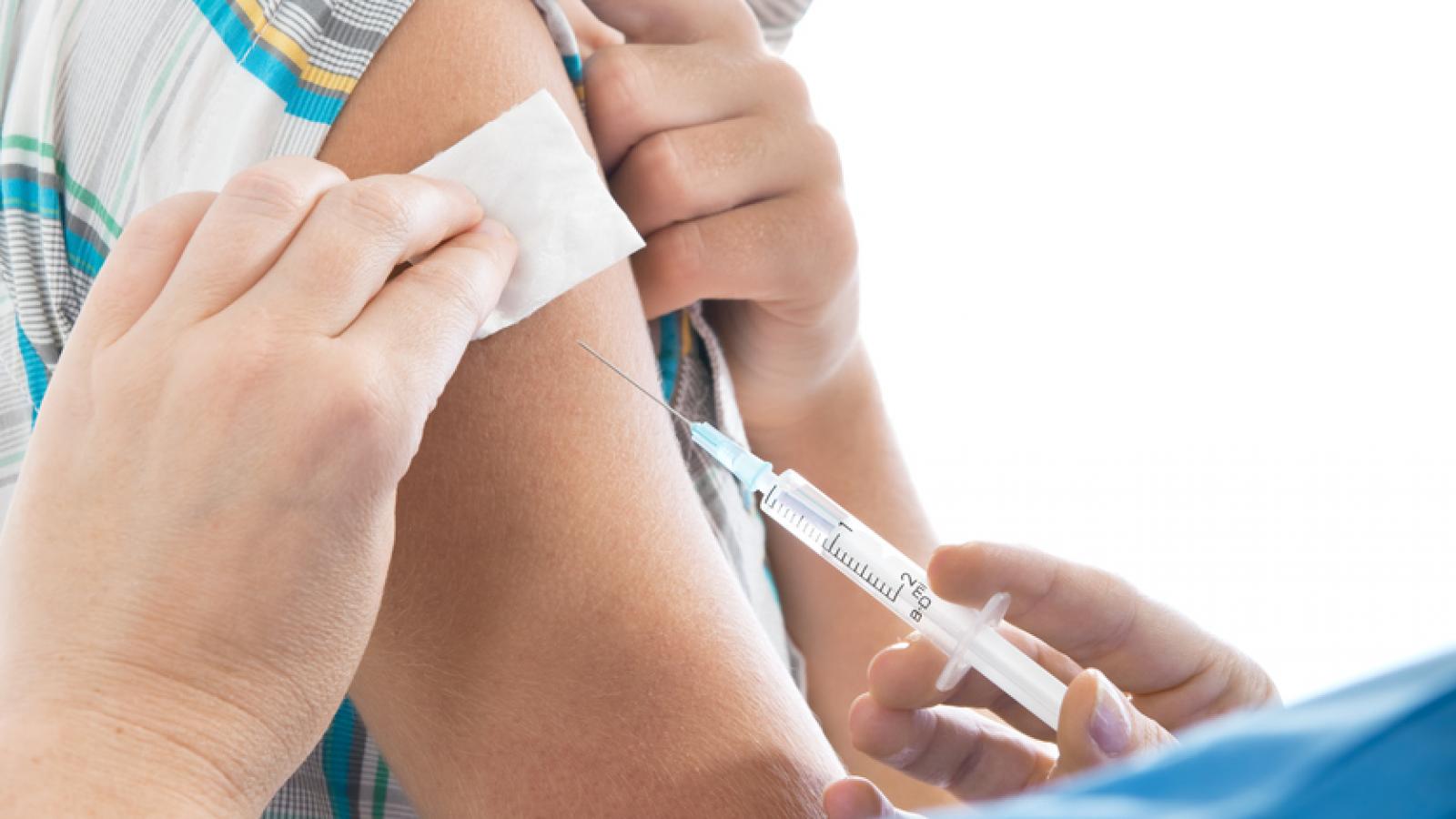 Teenage boy getting a needle