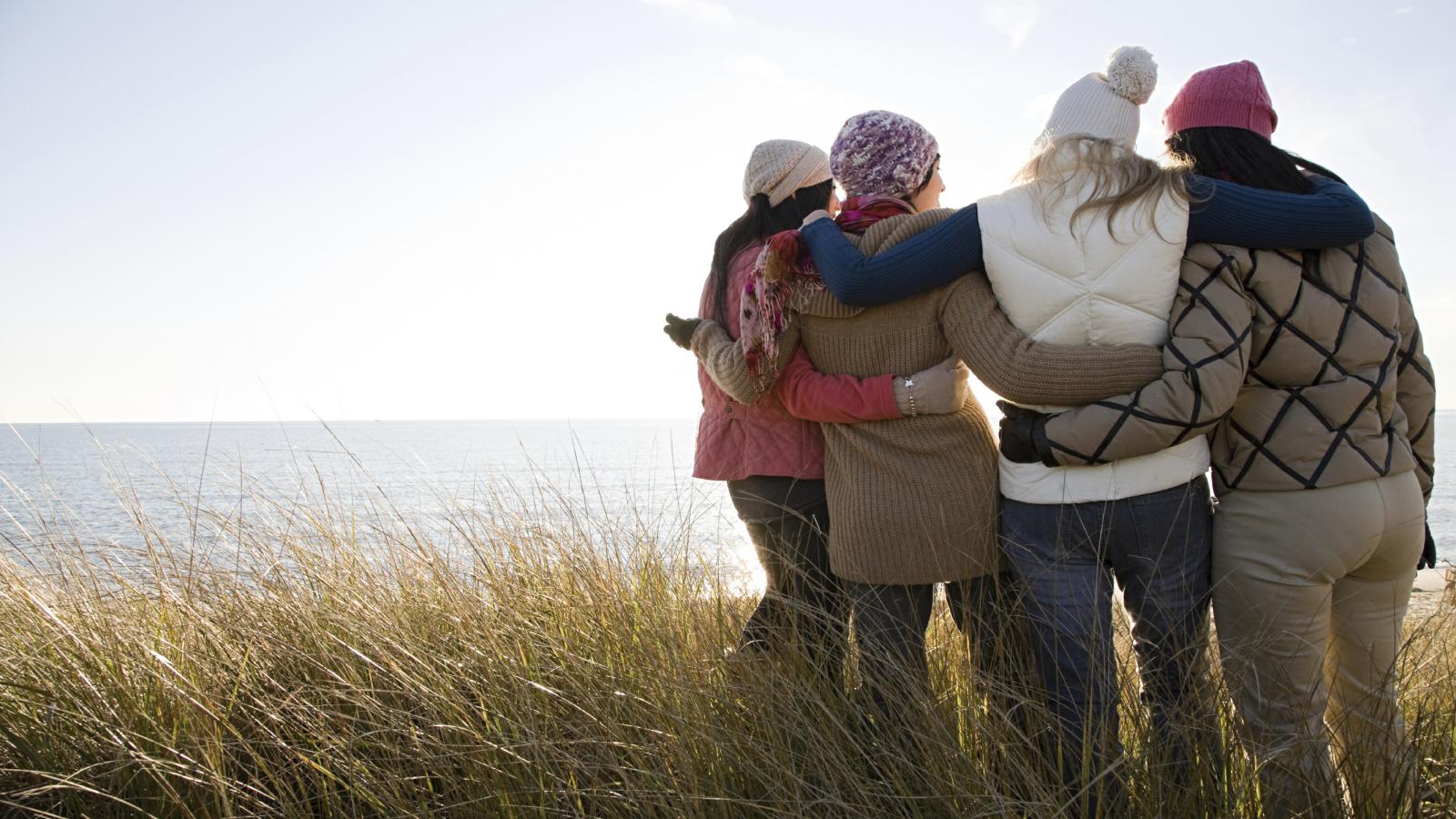 Group of friends hugging each other