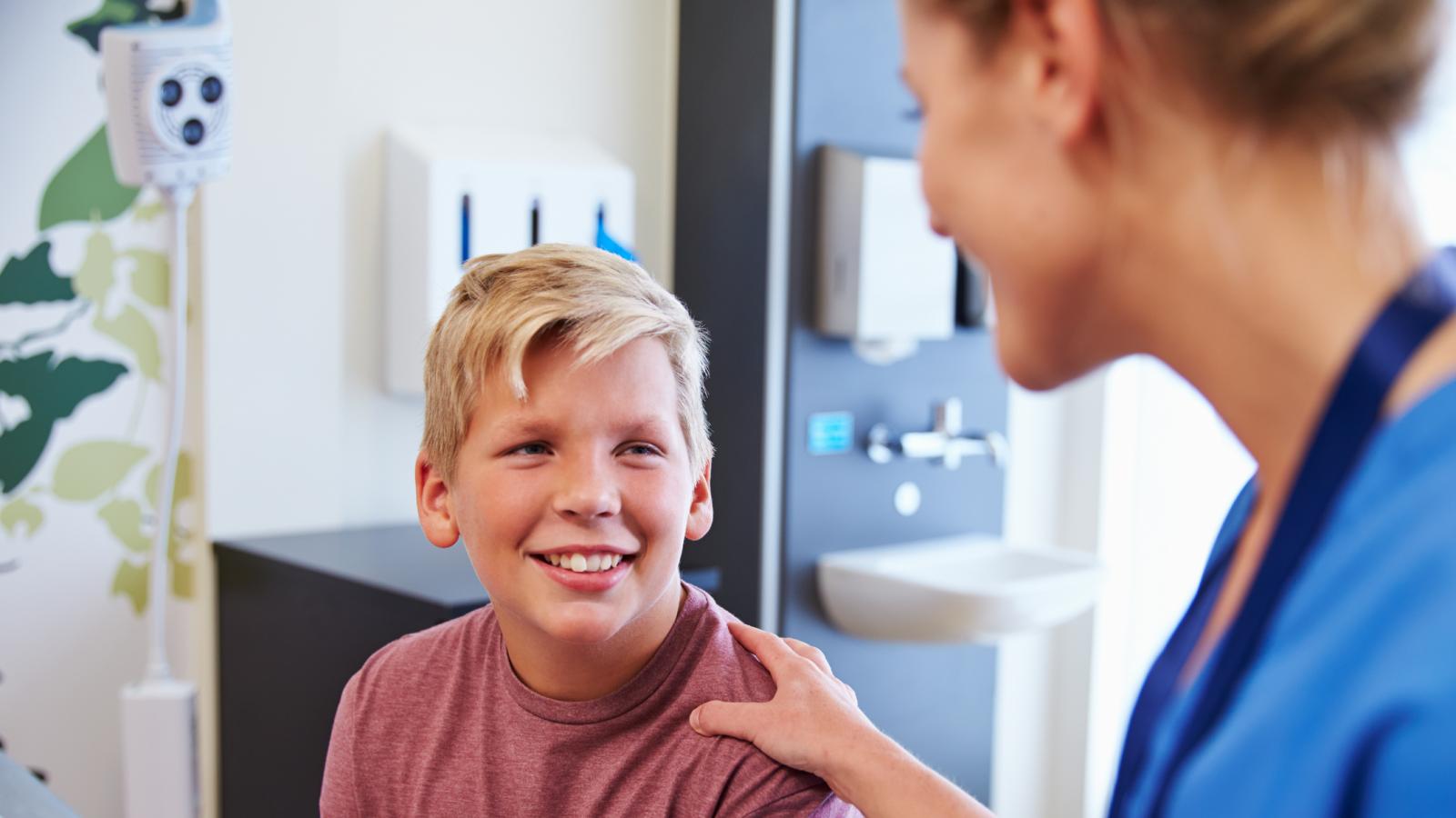 Doctor talking to a young boy