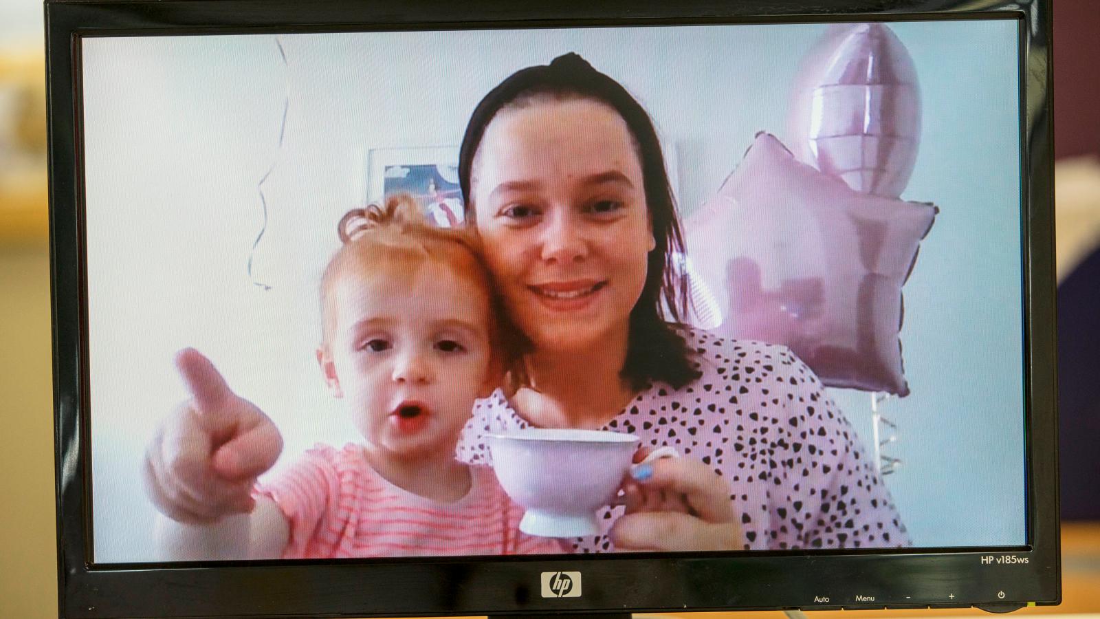 woman and child holding cup