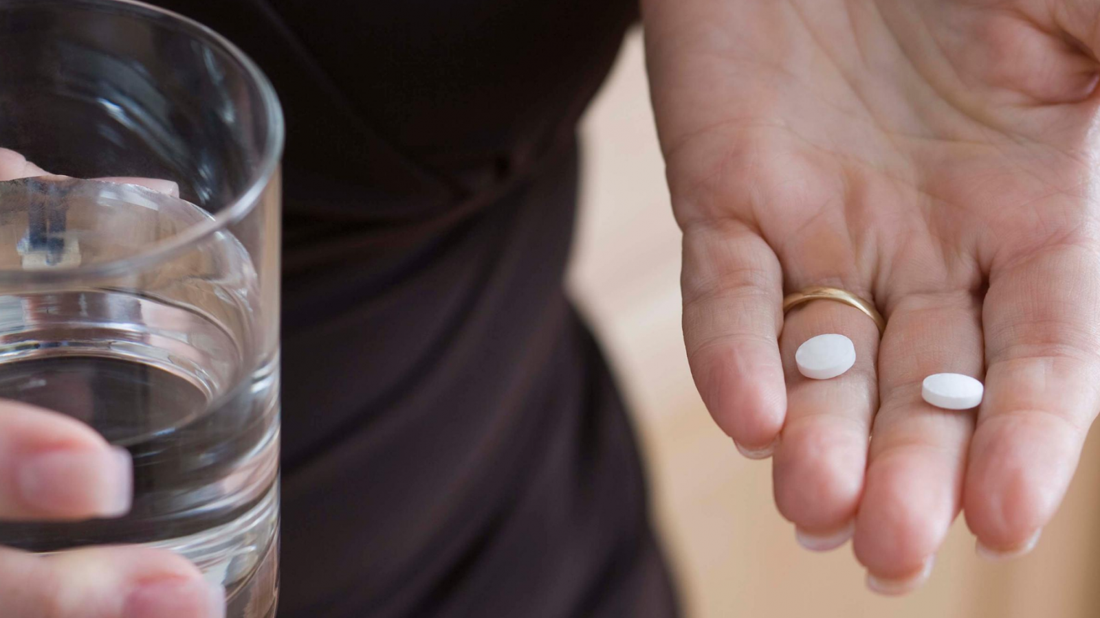 Hand holding pills