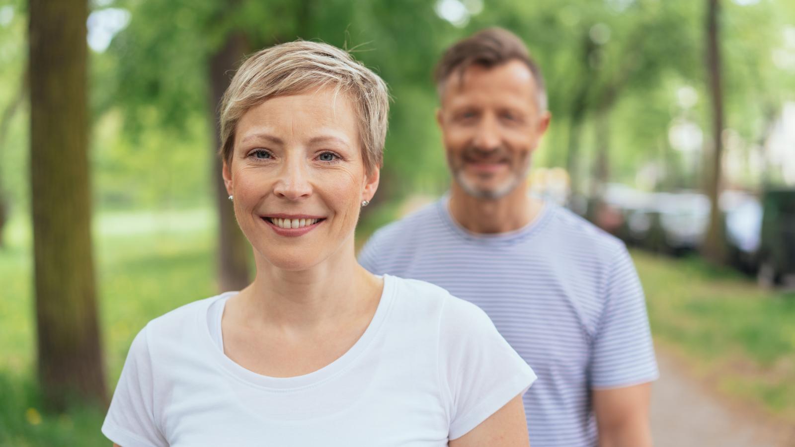A mature woman and man out walking