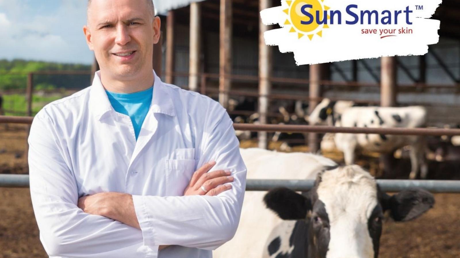 Be SunSmart on the farm Irish dairy farmer with cow