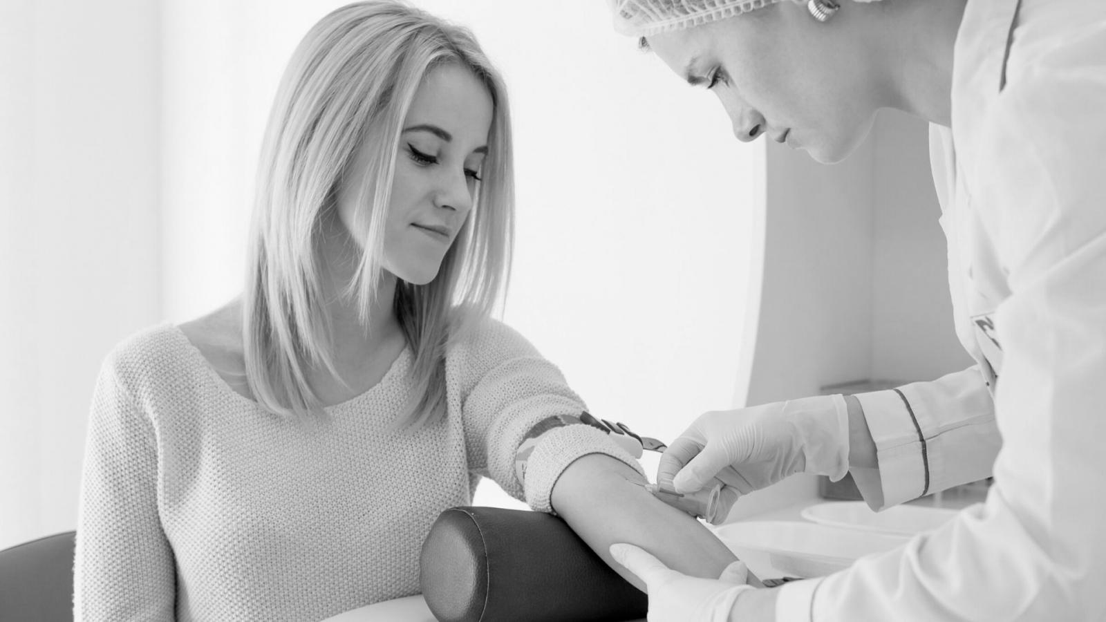 Teenager undergoing blood test