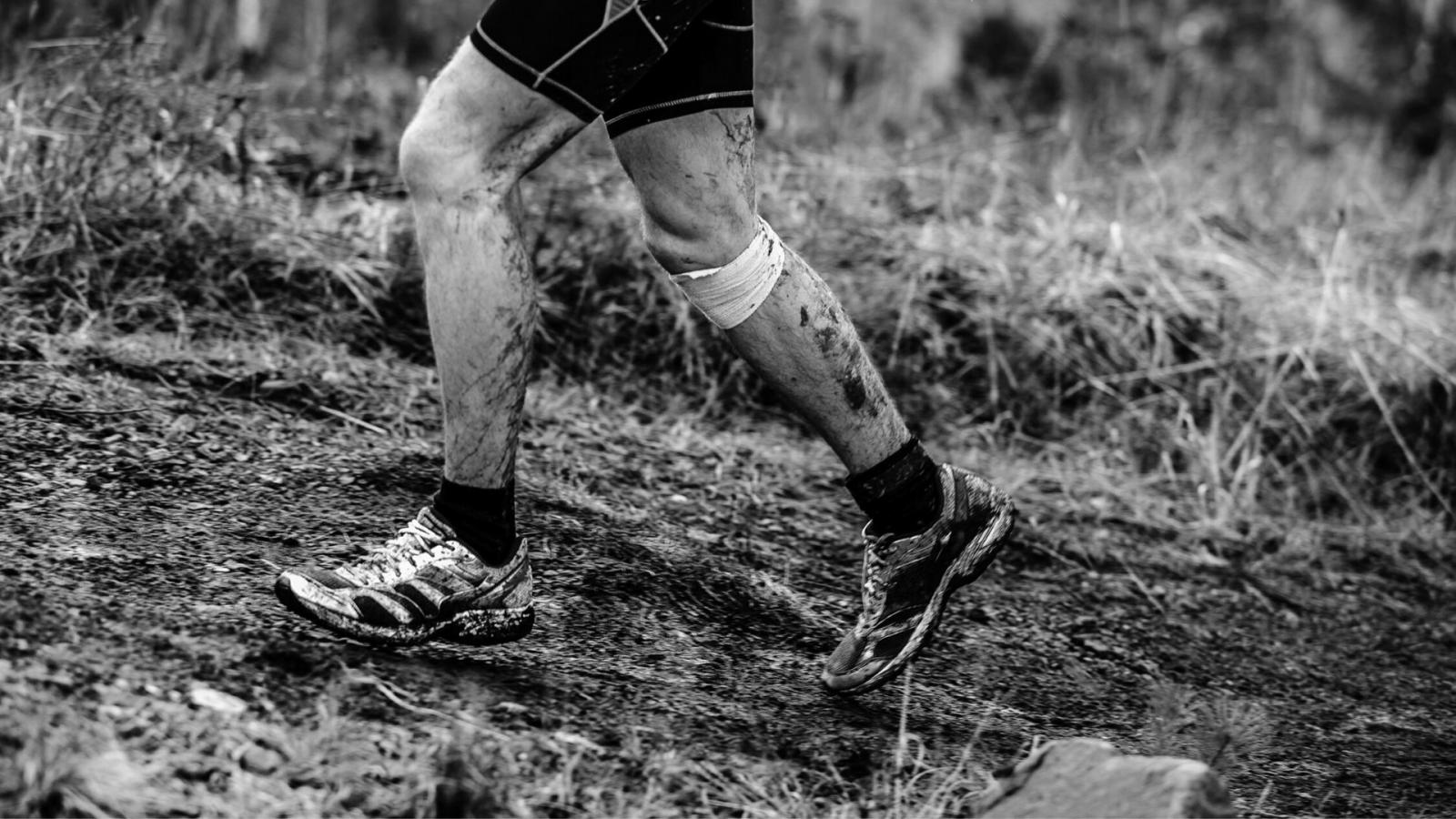 Man taking part in mud run