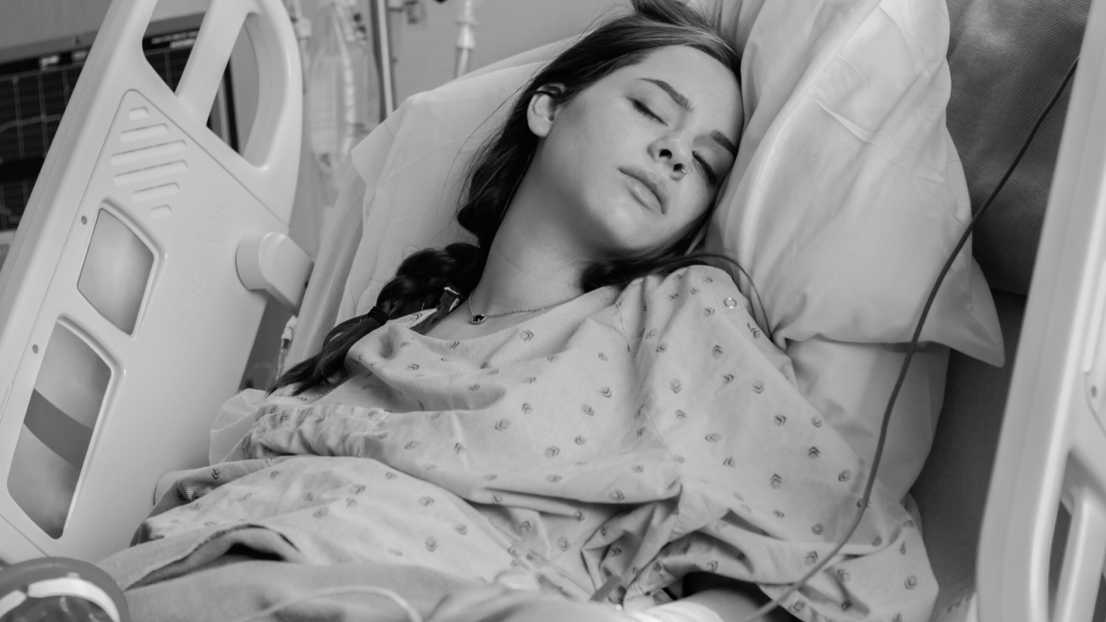 woman sleeping in hospital bed